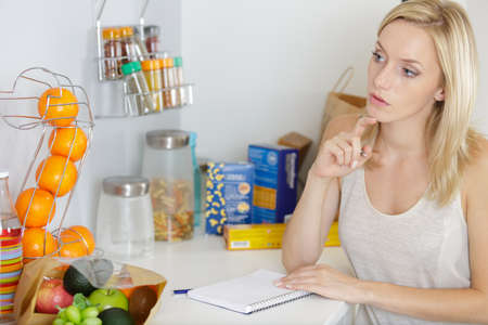 notebook with a shopping list close-upの写真素材