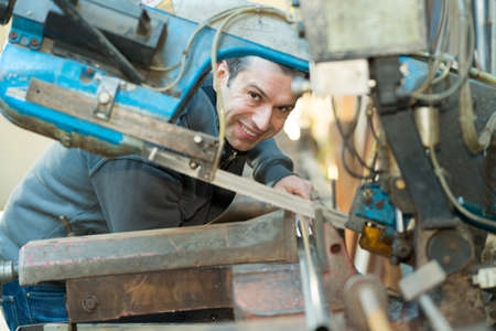 engineer measuring component with micrometerの写真素材