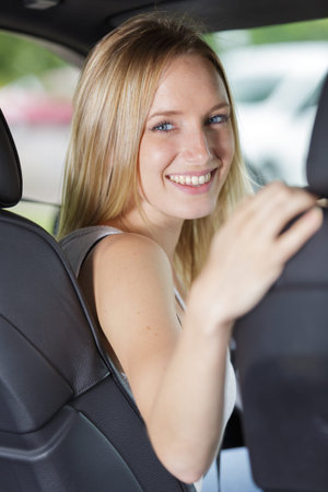young female driver smiling