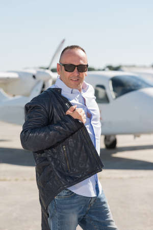 businessman outside of helicopterの写真素材