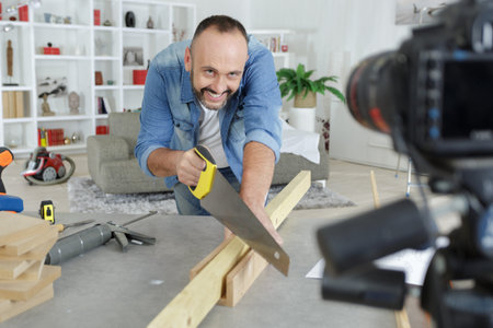 Man recording diy repair on camera for his blog