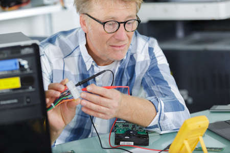 a man testing a motherboardの写真素材