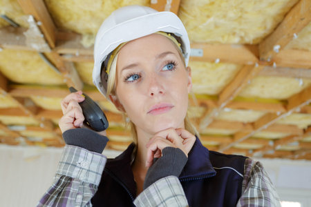 female worker talking with a walkie talkie