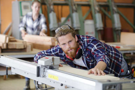 man works in the carpentry workshopの写真素材