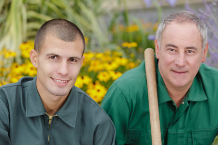 portrait of 2 gardeners in garden