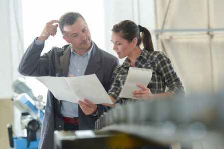 young engineer woman shows her co-worker