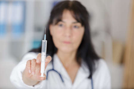 nurse ready to make an injectionの写真素材