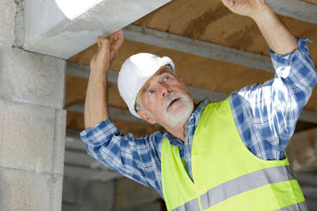 engineer or architect checking concrete wallの写真素材