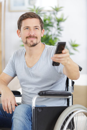 disabled man watching sports on tv