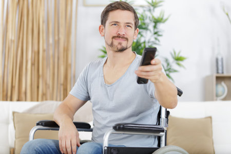 disabled man watching sports on tv