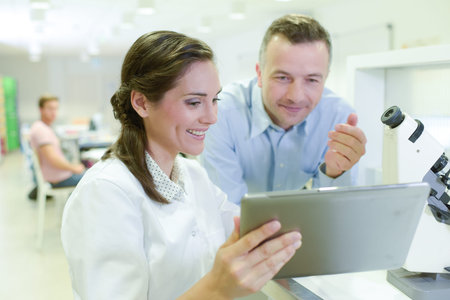 man and woman are in lab