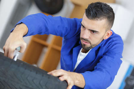 fixing the tireの写真素材