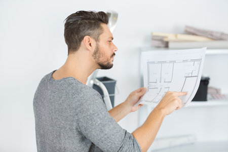 man architect checks a new residential project