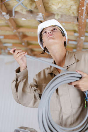 woman with pipes in construction siteの写真素材