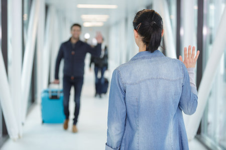woman waiting for man in airport