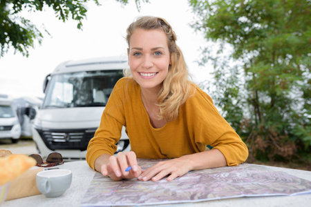 traveler with map in minivan