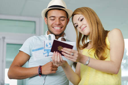 young tourist couple going traveling at airport terminalの写真素材