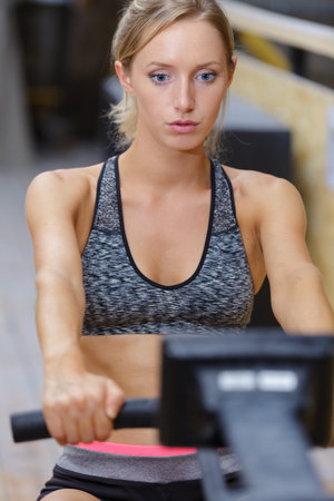 attractive woman exercising at gym