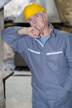 portrait of senior man in under construction