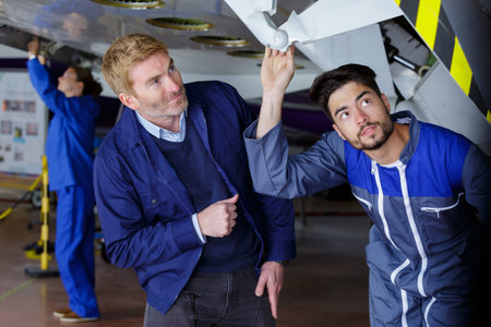 airport staff looking at aircraft