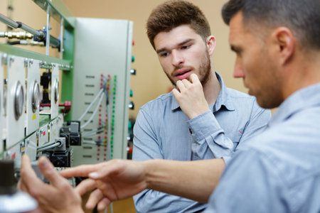 two worker in factory on the machine