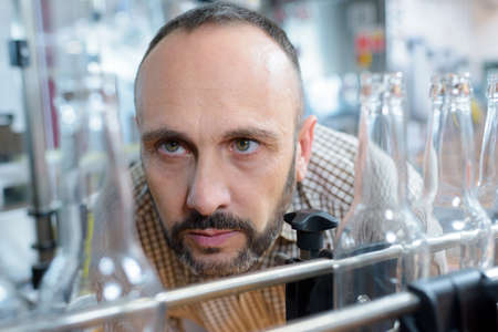 a man in bottling plantの写真素材