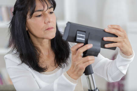 checking a modern actual vacuum cleanerの写真素材