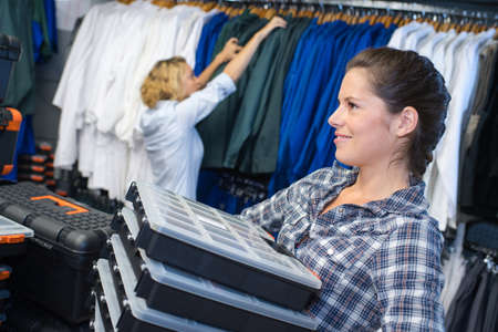 saleswoman working in clothing storeの写真素材