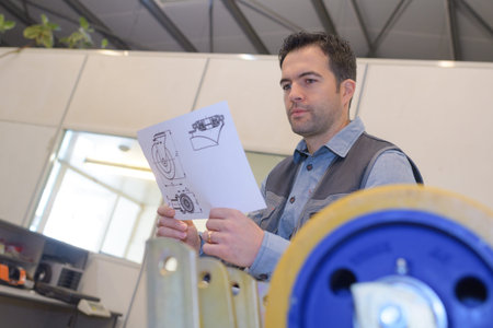 man checking assembled wheels into cart