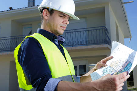 man with cottage plan constructionの写真素材