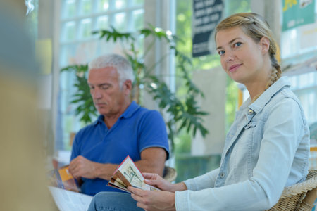different people sitting in a waiting roomの写真素材