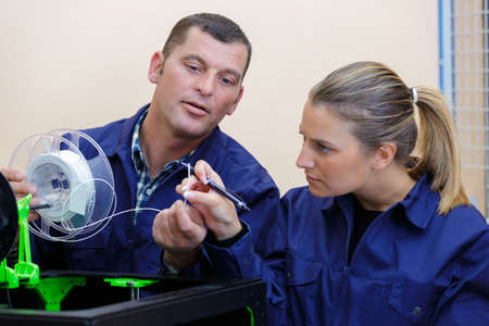 portrait of people working with new deviceの写真素材