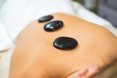 beautiful woman spa hot stone massage beauty treatments