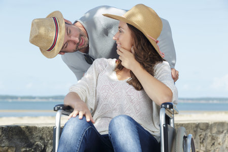 husband and paraplegic woman in wheelchair