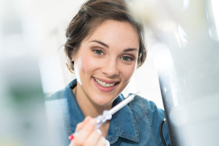 focused picture of woman holding screwdriver
