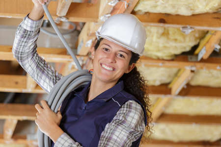 builder covering an electrical wireの写真素材