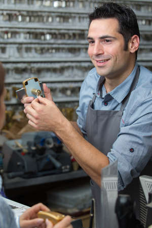 a happy man selling a lockerの写真素材