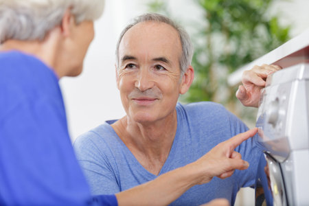 portrait of happy senior man smiling while wife