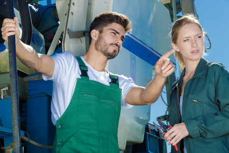 two seasonal farm workers outdoors