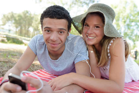 young couple in the parkの写真素材