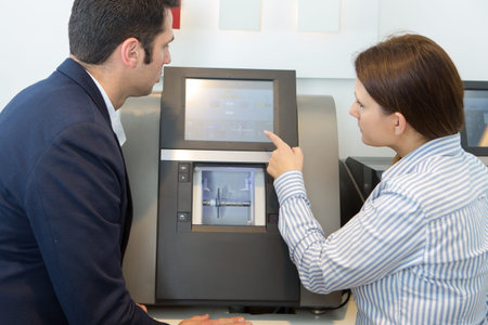 woman showing computer programming to client