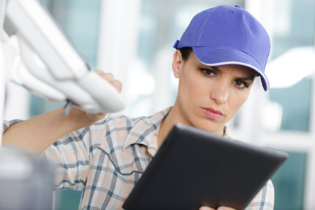 female technician using tablet control