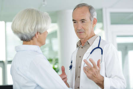 senior doctor with elderly patientの写真素材