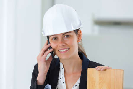 Female interior designer using her phoneの写真素材