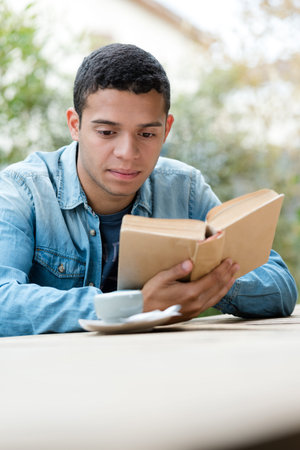 relaxation man reading a book outdoors