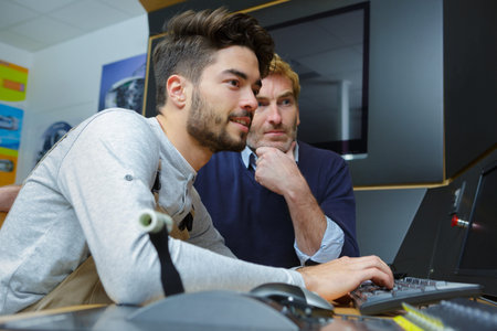 mentor and young man working together
