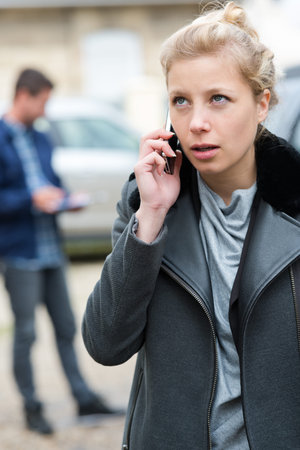 woman having a problem with a car calling for help