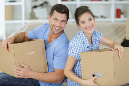 happy couple during moving houses