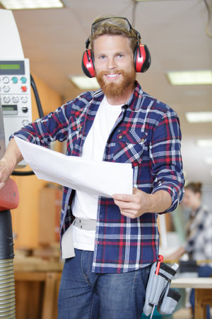 Man operating machines in factory