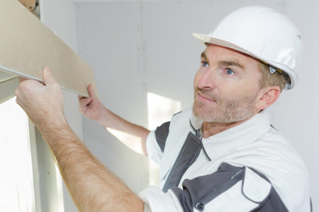 Man putting addition support frame